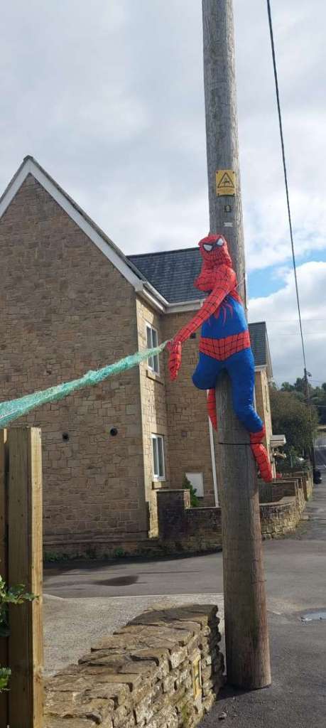 A screcrow dressed as Spiderman