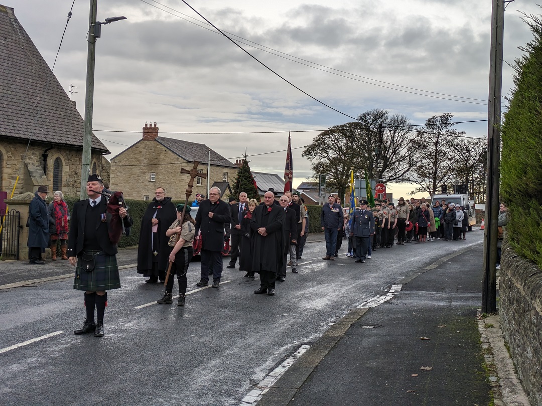 An image of the remembrance parade ready to set off from St John's Church to Castleside Cemetary